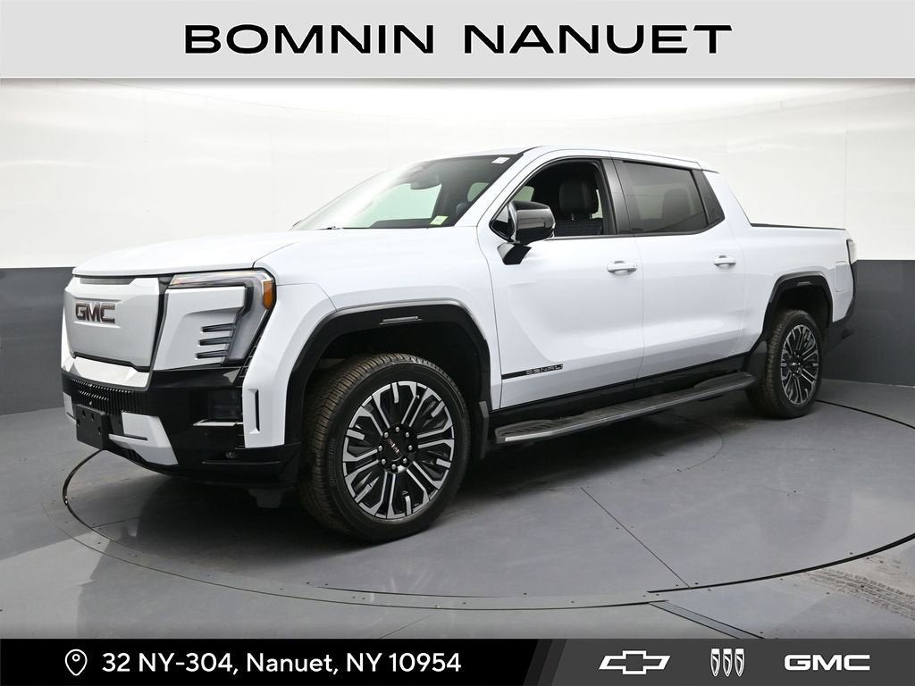 2026 GMC Sierra EV Denali Standard Range in Glacier White Tricoat — front three-quarter view