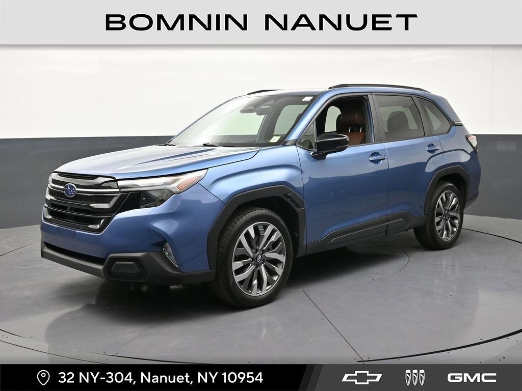 2025 Subaru Forester Touring in Blue — front three-quarter view